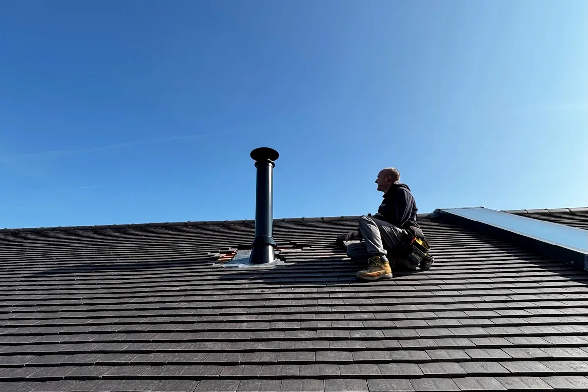 External insulated twin wall flue installation – 125mm black system with 45° roof flashing plate and terminal in Whitstable, Kent – Allchimneys Kent